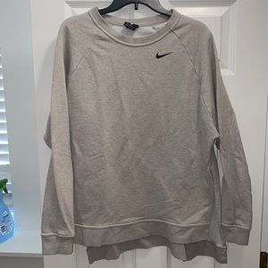 Gray Nike sweatshirt Slits up the sides and pocket